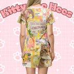 Pink lemonade kitty print T-shirt dress by Printify featuring cute cat design, all-over print, lightweight and casual for everyday wear.