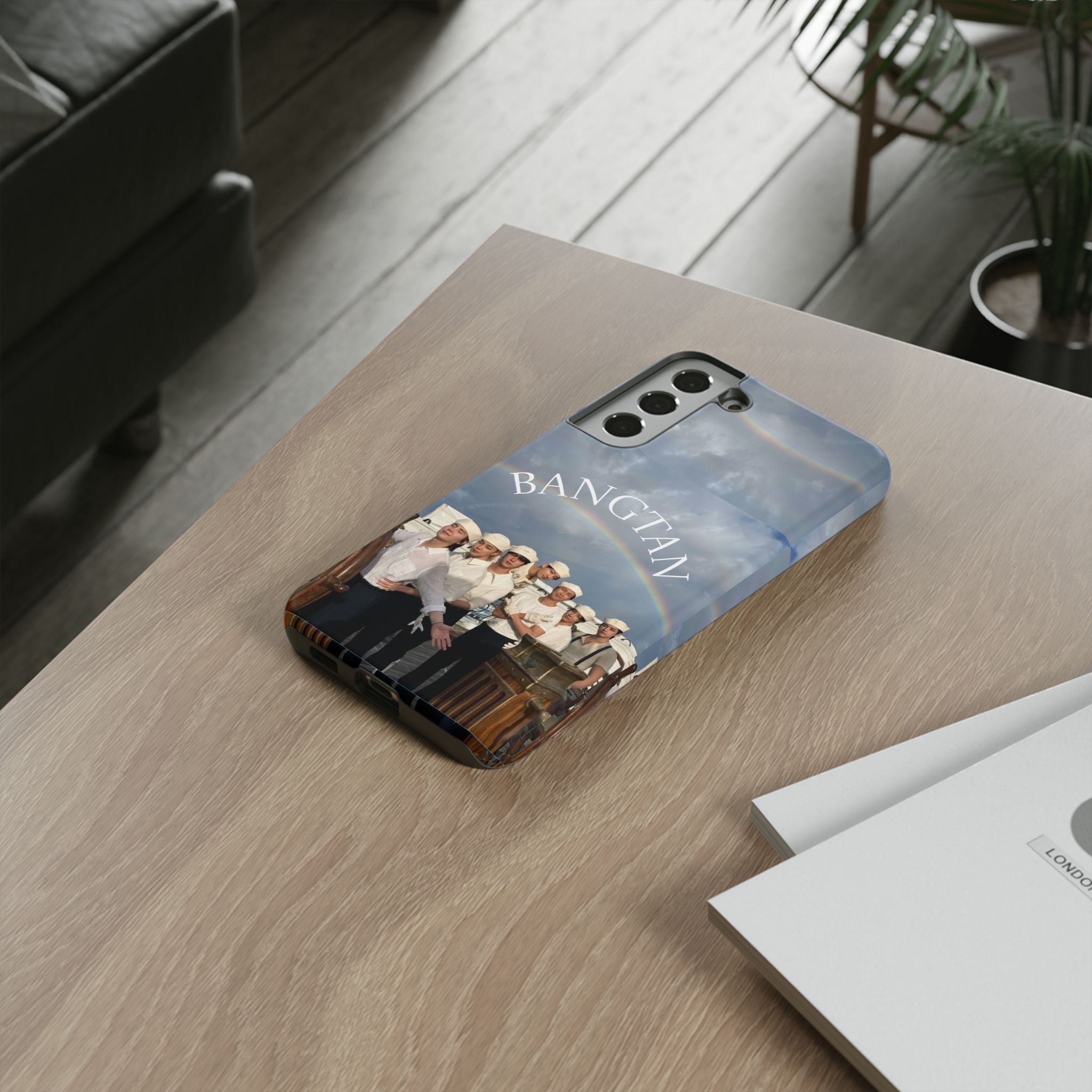 Cute BTS Sailor phone case for iPhone and Samsung, featuring sailor-themed design from the Swim BTS collection by Printify.