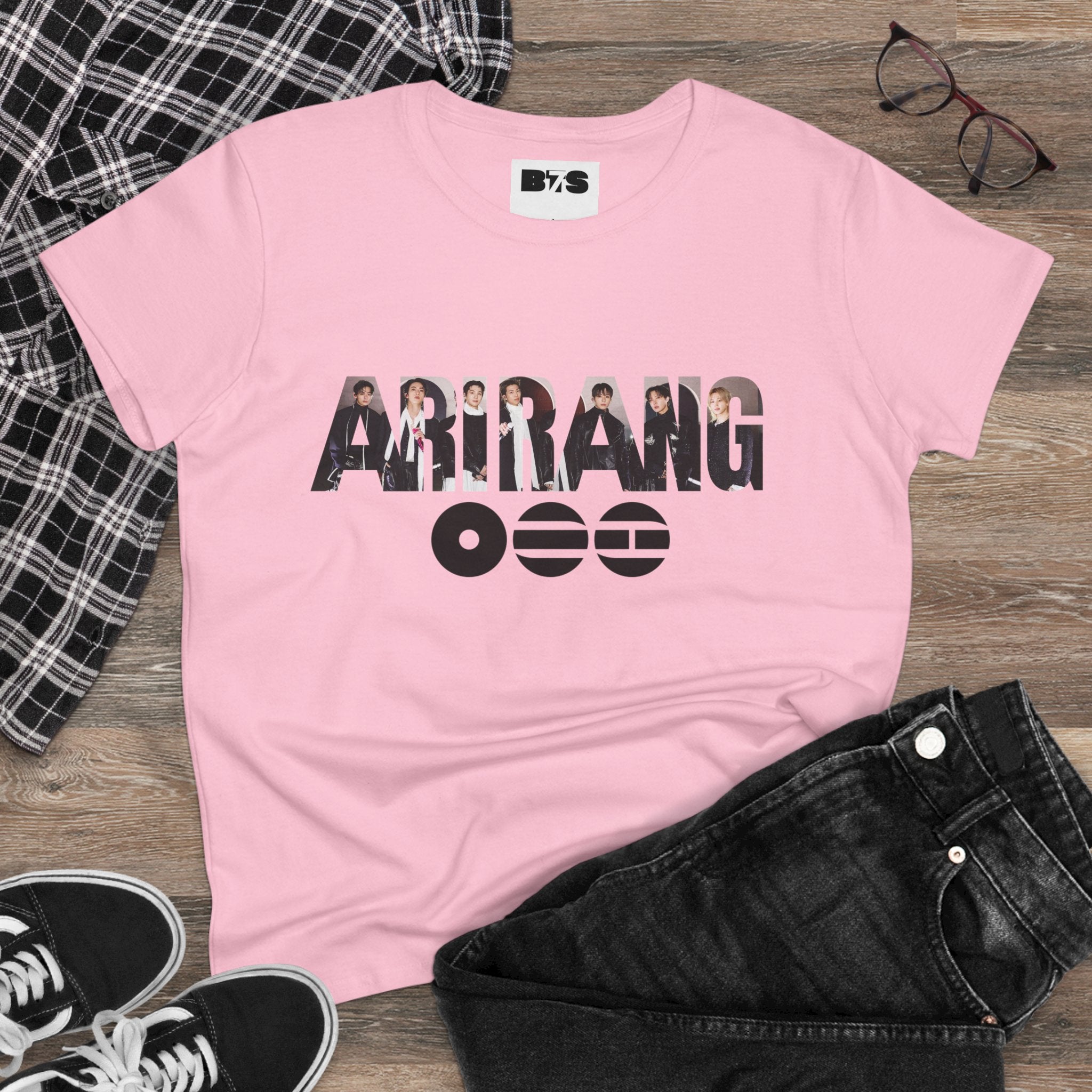 BTS ARIRANG graphic T-shirt featuring BTS logo and member names, casual cotton tee from Printify, worn by a person.
