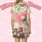 Pink and green floral apple star print T-shirt dress by Printify featuring all-over floral and star patterns for casual spring wear.