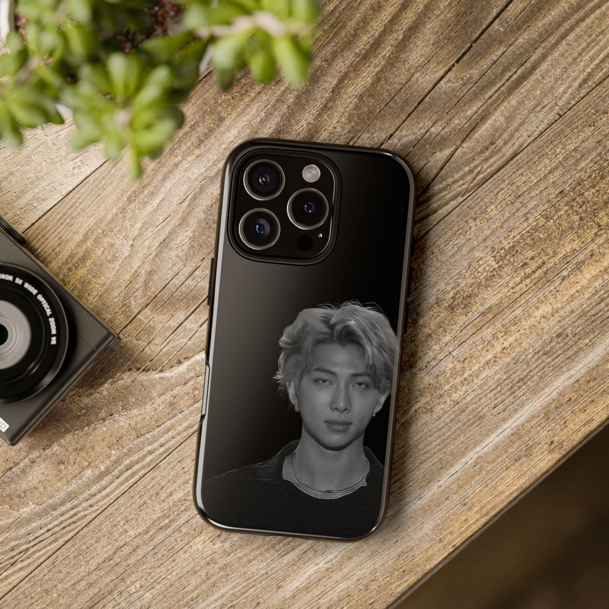 Namjoon BTS concert-themed iPhone case by Printify, featuring a durable protector with vibrant design and artistic details.