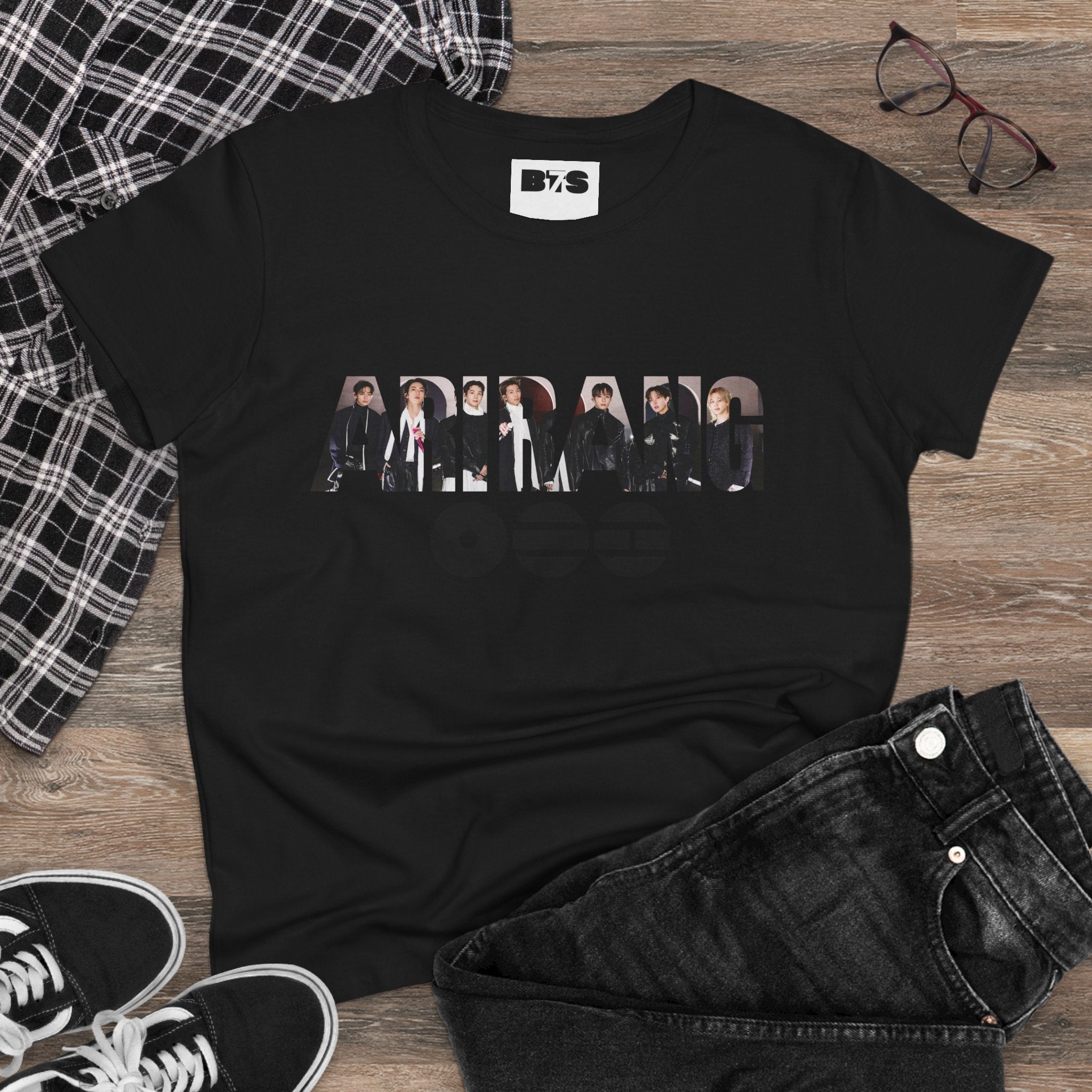 White BTS ARIRANG graphic T-shirt featuring band logo, member names, and colorful BTS print on front.