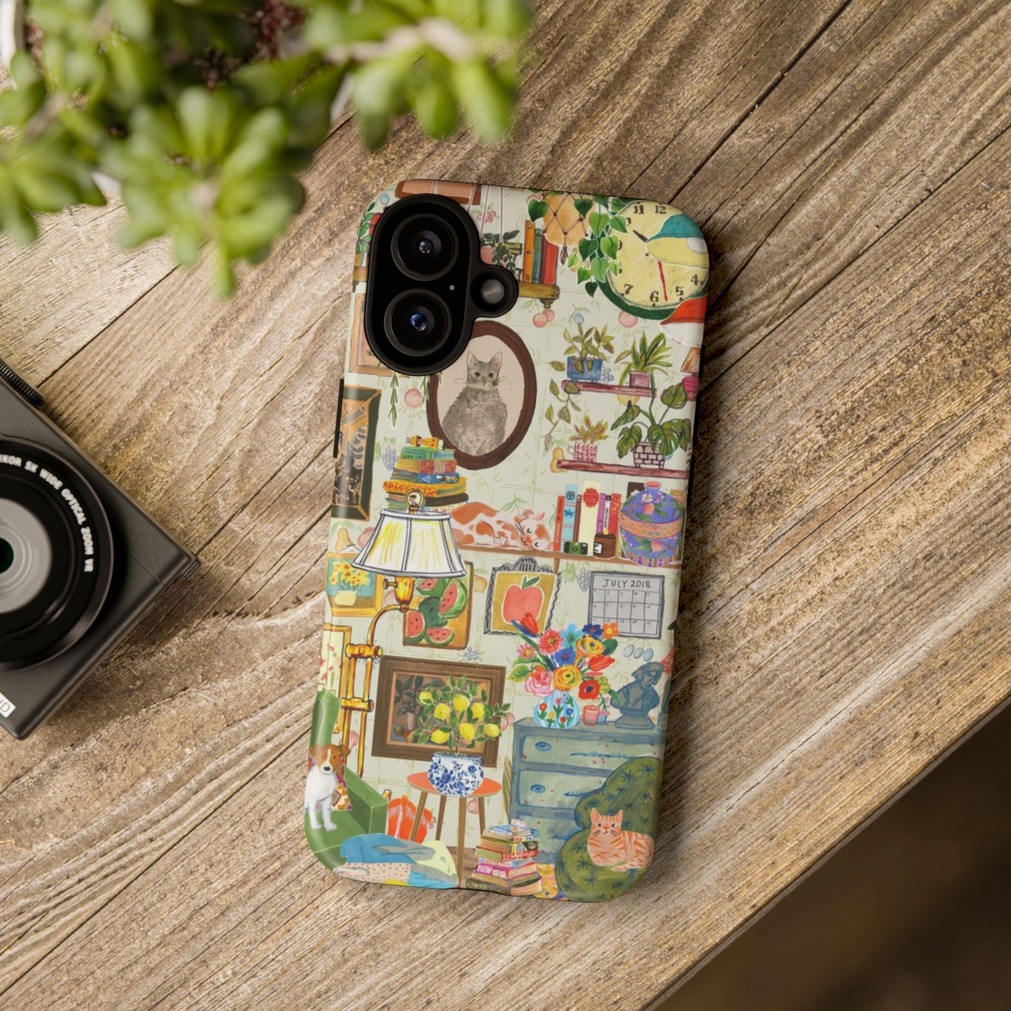Cute cat portrait phone case for iPhone 17, stylish framed pet design, cozy living room scene, Printify brand.