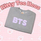 Lavender BTS Logo Arirang Crewneck Sweatshirt with K-pop band print, comfortable concert sweater by Printify.