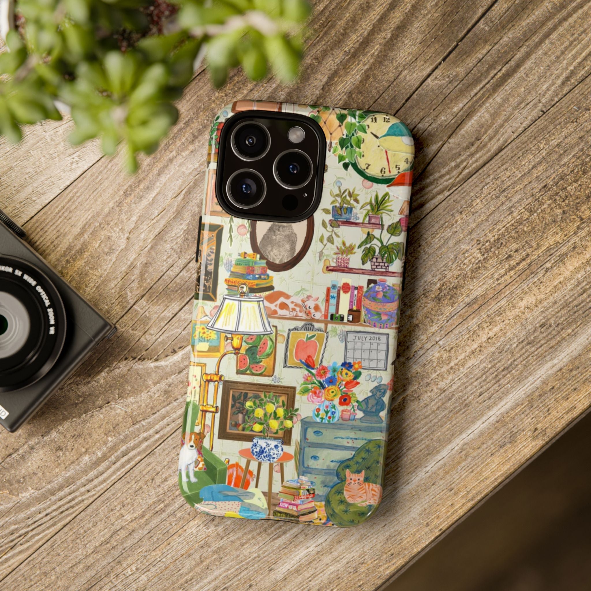 Cute cat portrait phone case for iPhone 17 featuring a cozy living room scene, stylish and protective Printify brand design.