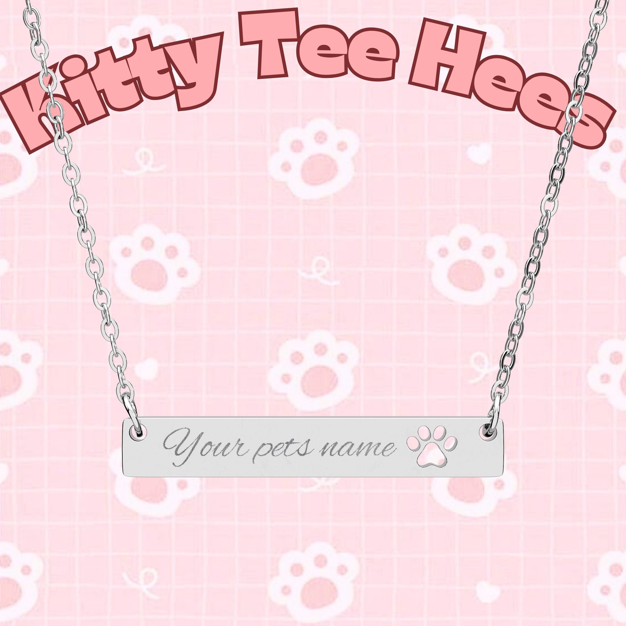 Silver cutout paw print bar necklace with engraved name pendant, paw print jewelry accessory on a chain.