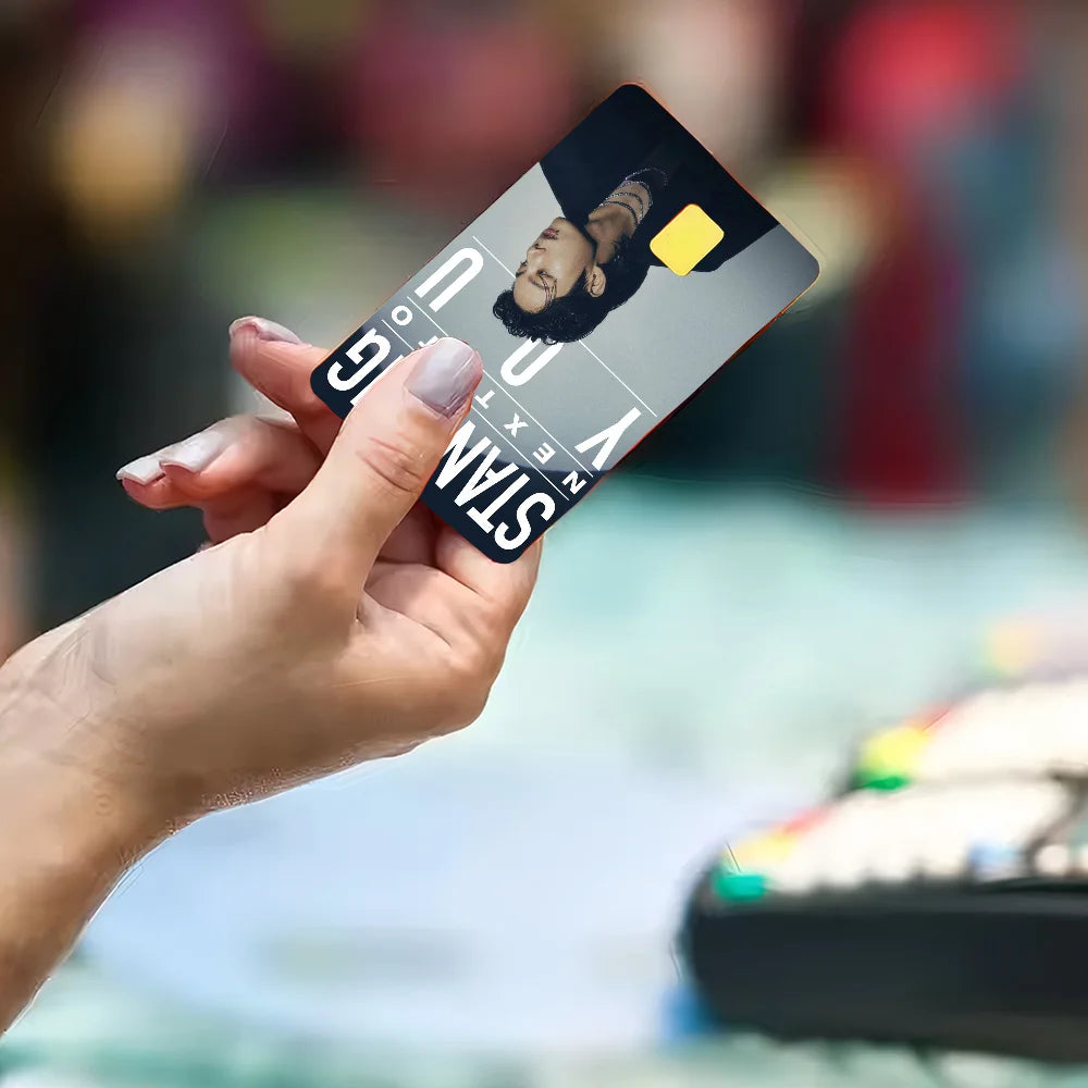 Jung Kook K-pop poster sticker on clear film cover case for debit or credit cards, featuring anime and game-themed artwork.